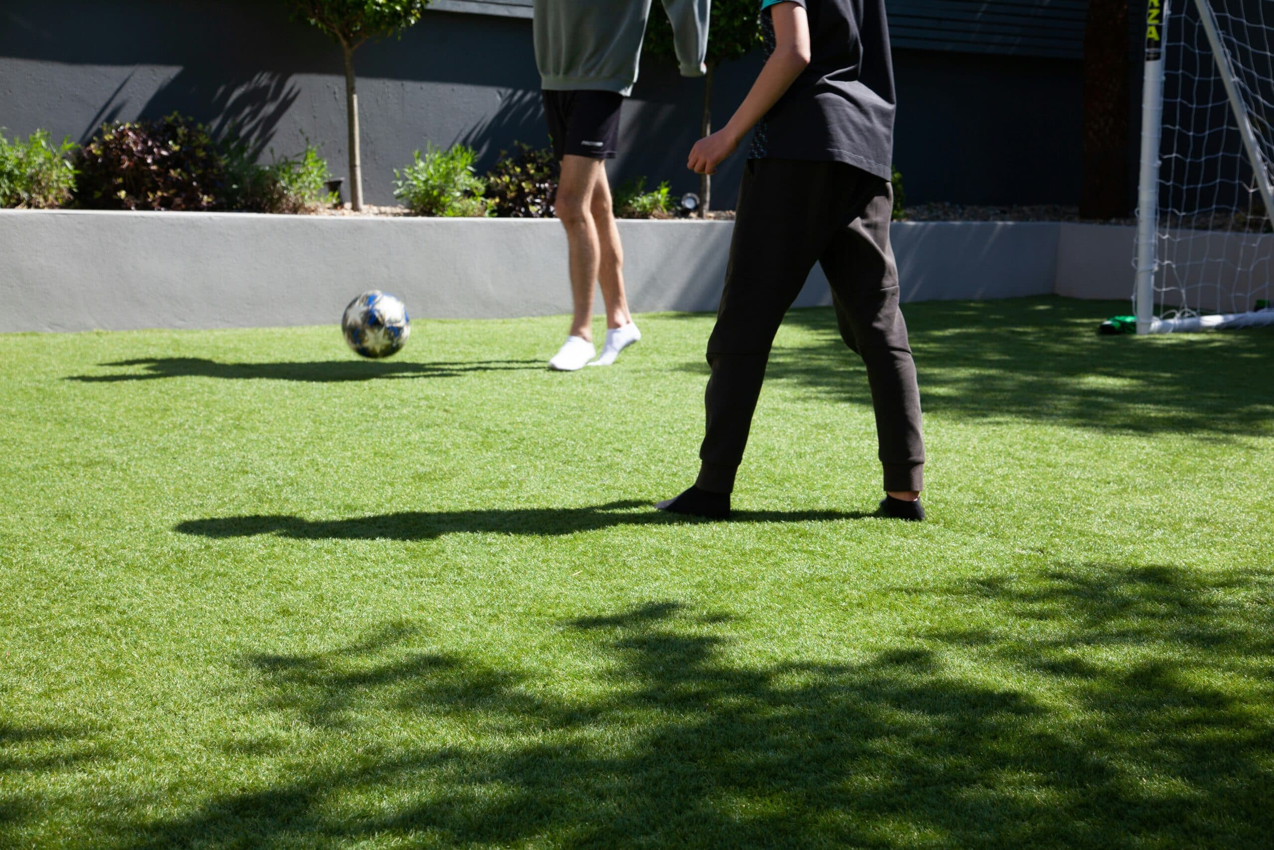 man in blue and white soccer jersey playing soccer